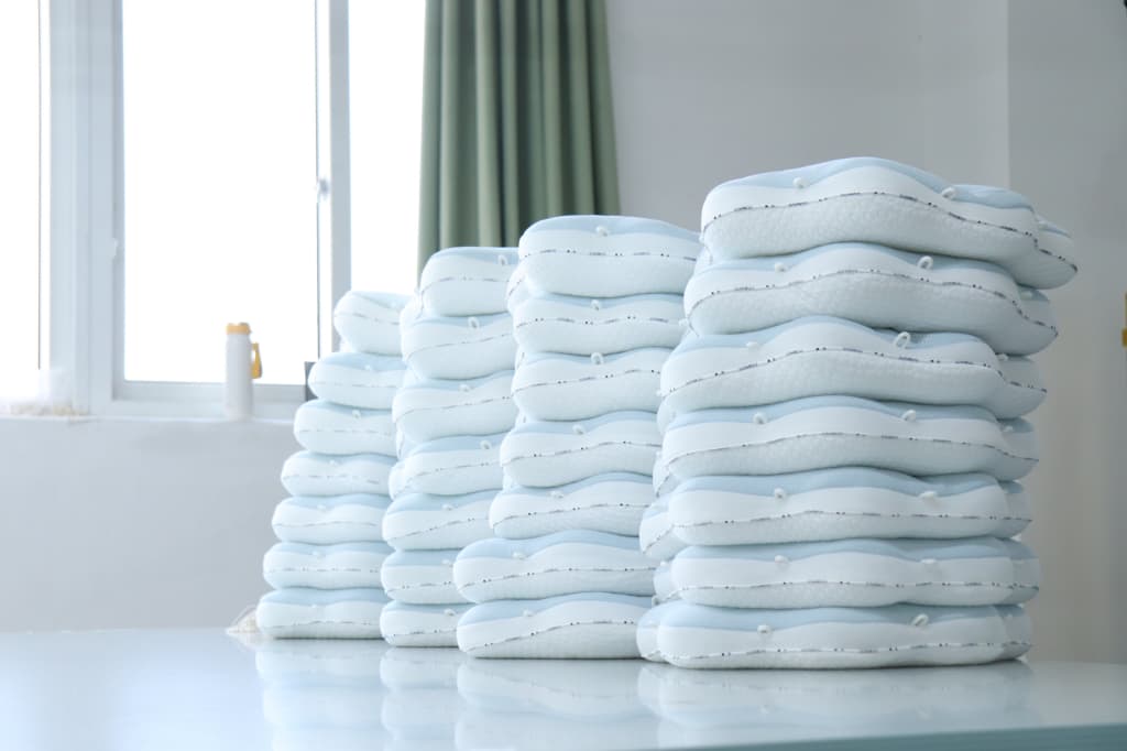 Mefiss bulk production photo of pillows -- custom home textile manufacturing